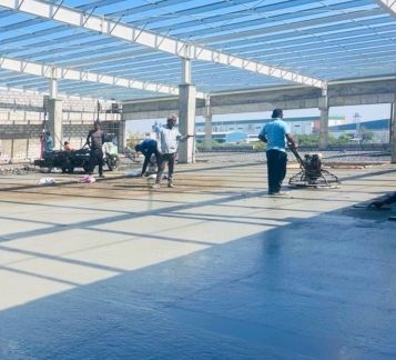 Coated floor under roof sheeting